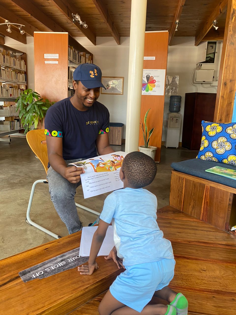 Reading closely with one child at Alliance Française - Lusaka