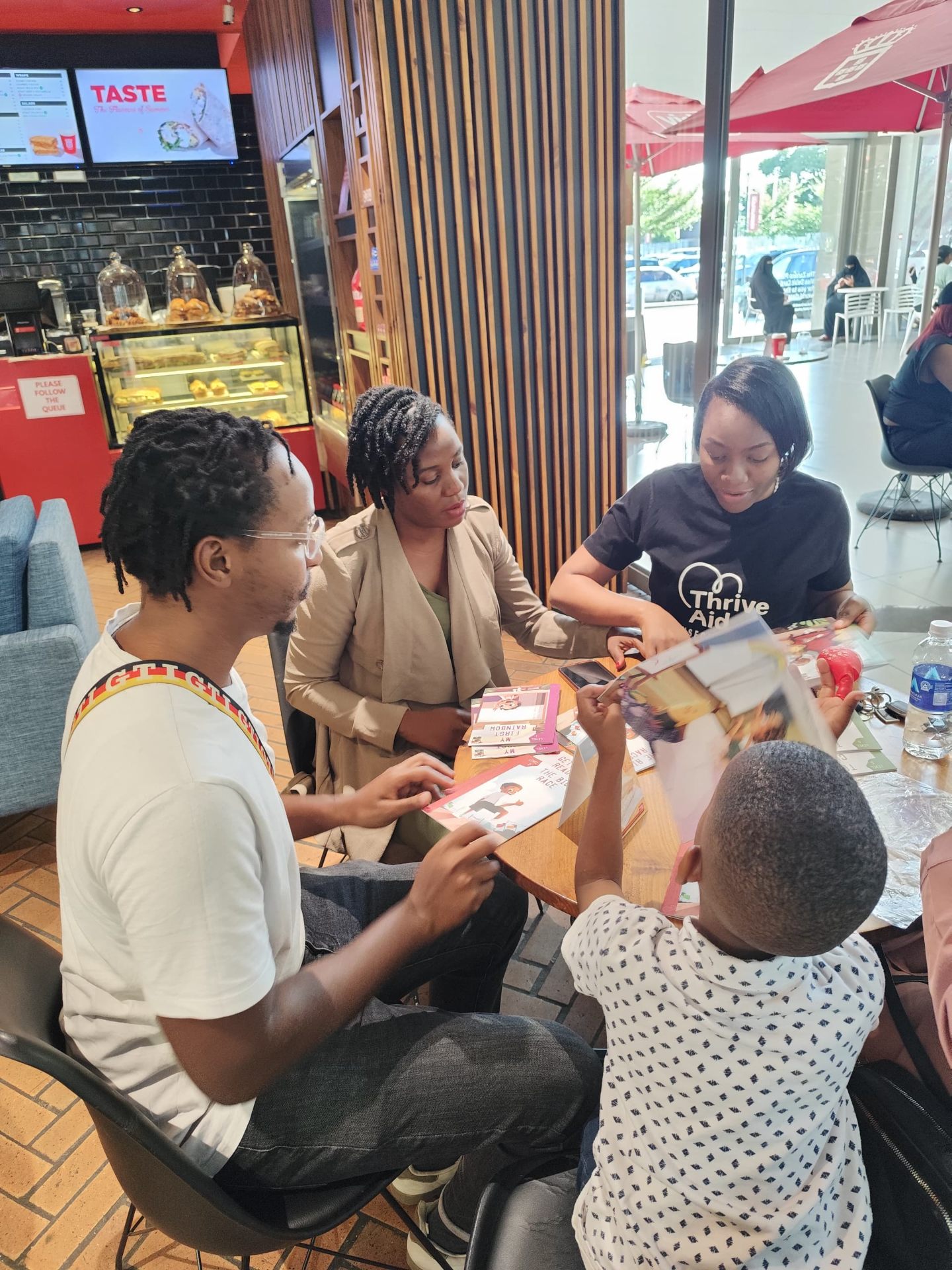 Book Handover with the Thrive Aid team - Lusaka