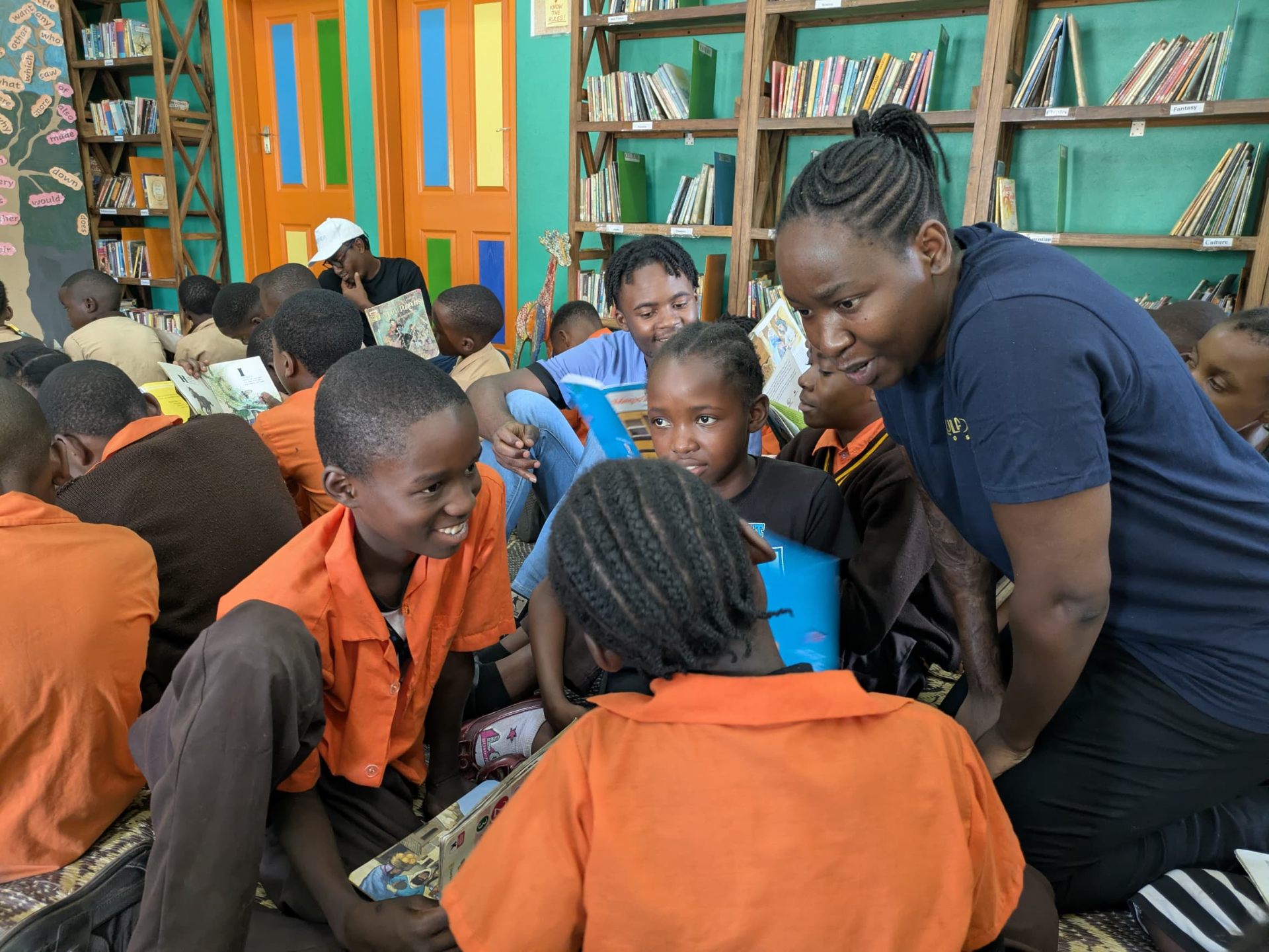 One-on-one reading time at Impact One Initiative - Lusaka